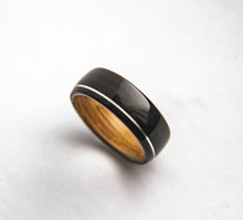 Load image into Gallery viewer, Mens Wedding band featuring Whisky Oak, Ebony with Offset Silver Inlay.